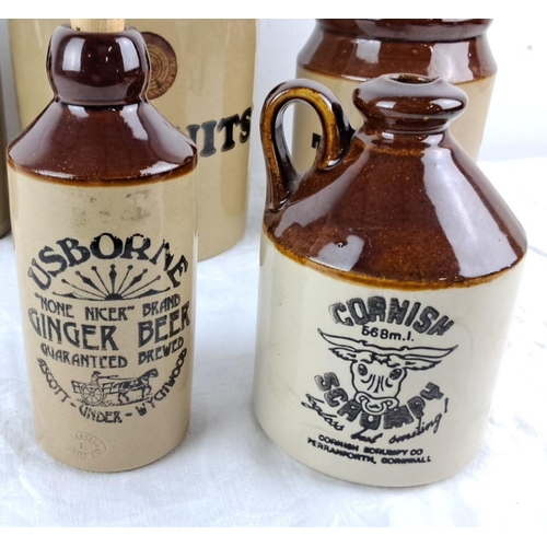 4 - Set of vintage stoneware jars and bottles with cork caps, featuring labeled containers.