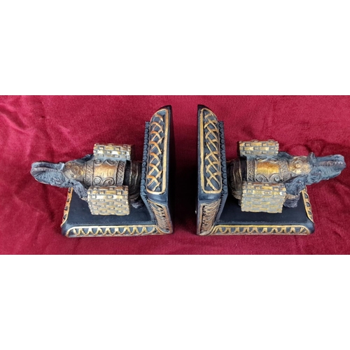 44 - Pair of elephant-themed bookends, made in a resin material with intricate detailing and gilded accen... 