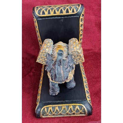 44 - Pair of elephant-themed bookends, made in a resin material with intricate detailing and gilded accen... 