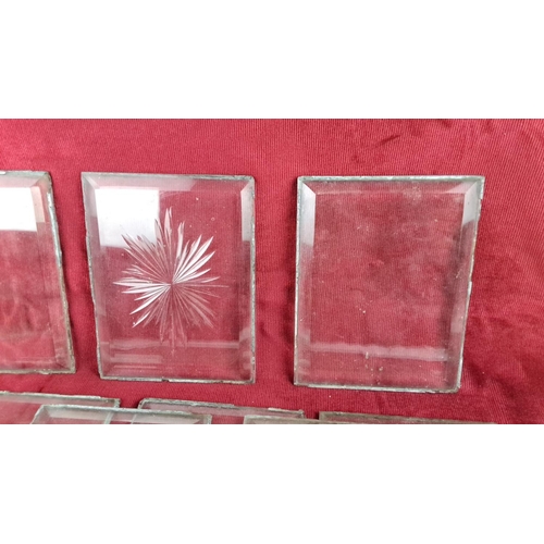 53 - Set of eight vintage beveled glass panels, one featuring etched starburst design.