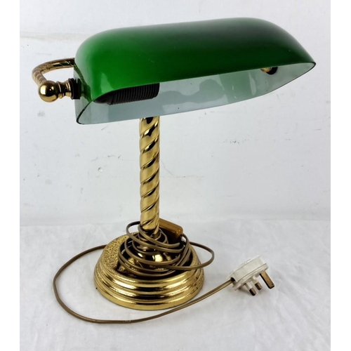 62 - Brass bankers desk lamp with green glass shade, featuring a spiraled column design and classic plug-... 