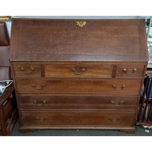 64 - Late Georgian oak bureau with brass handles, featuring a fall-front desk and four graduated drawers ... 