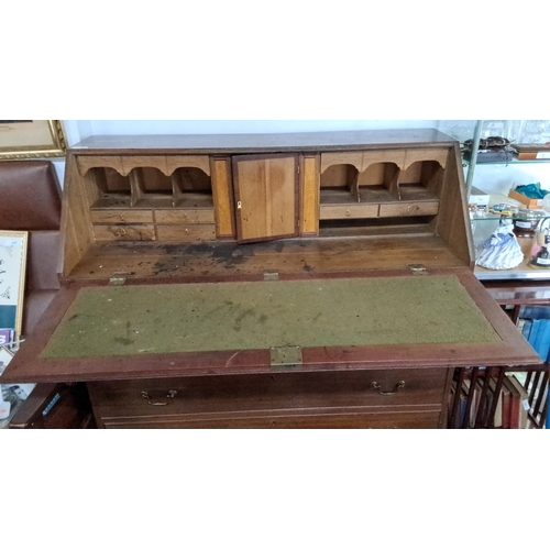 64 - Late Georgian oak bureau with brass handles, featuring a fall-front desk and four graduated drawers ... 