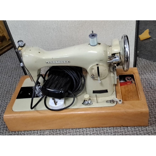 75 - Vintage Brother electric sewing machine with wooden base. It has a classic design and includes a foo... 