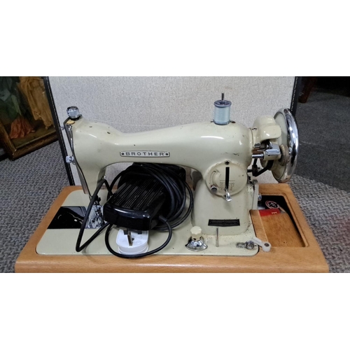 75 - Vintage Brother electric sewing machine with wooden base. It has a classic design and includes a foo... 