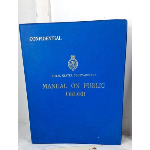 76 - Mixed lot of Royal Ulster Constabulary memorabilia, including manuals, photographs, magazines, cerem... 