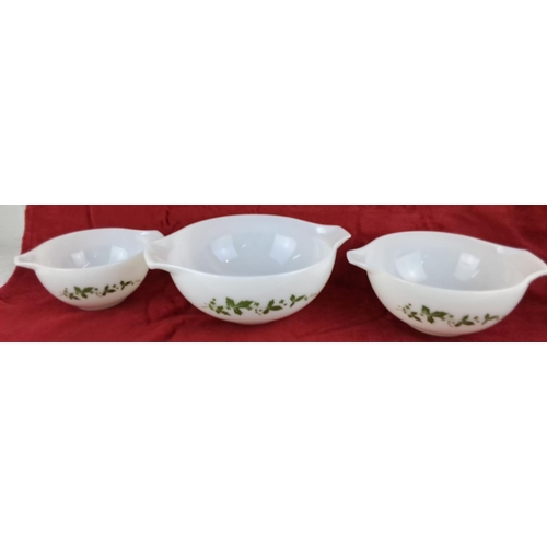 81 - Set of three vintage Pyrex mixing bowls, white milk glass with green floral pattern, marked 