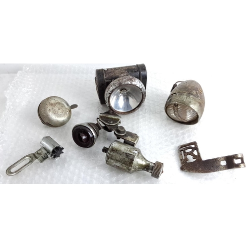 86 - Vintage bicycle accessories, including two headlamps, a bicycle bell, a dynamo, and other components... 