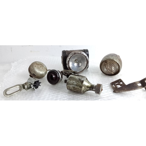 86 - Vintage bicycle accessories, including two headlamps, a bicycle bell, a dynamo, and other components... 