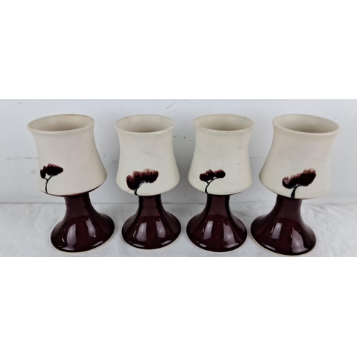 90 - Set of four 'Cool Mountain Pottery' Studio Pottery goblets with floral motifs, cream exteriors, and ... 