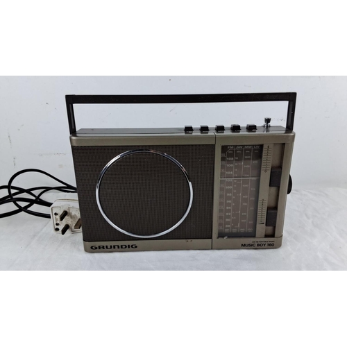 91 - Grundig Music Boy 160 AM/FM portable radio with built-in handle and tuning dials. Mid-to-late 20th c... 