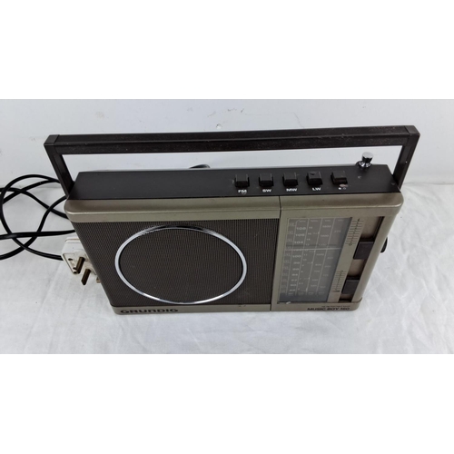 91 - Grundig Music Boy 160 AM/FM portable radio with built-in handle and tuning dials. Mid-to-late 20th c... 