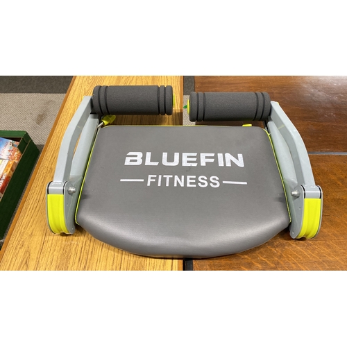 456 - Bluefin Fitness exercise machine, featuring padded grips and a cushioned seat.