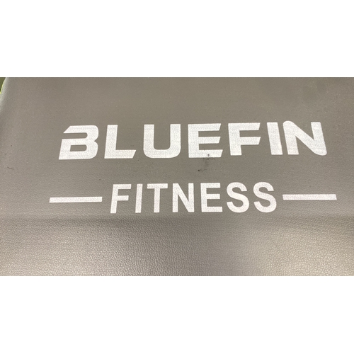 456 - Bluefin Fitness exercise machine, featuring padded grips and a cushioned seat.