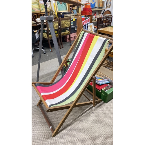 463 - Vintage wooden deck chair with colorful striped fabric seat.