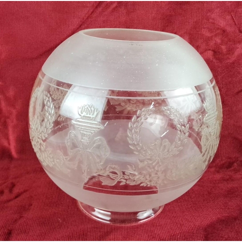 104 - Frosted glass oil lamp globe with an etched laurel wreath and torch design.