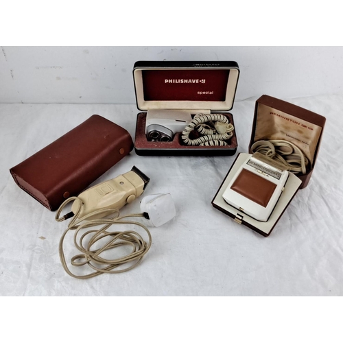 113 - Mixed lot of three vintage electric razors, including a Philishave 83 Special, Remington 25, and an ... 