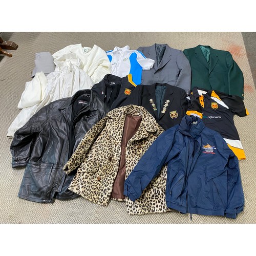 80 - A large assortment of jackets, blazers and coats. To include a Portrush bowls jacket adorned with ba... 