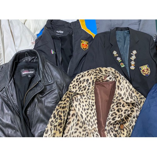 80 - A large assortment of jackets, blazers and coats. To include a Portrush bowls jacket adorned with ba... 