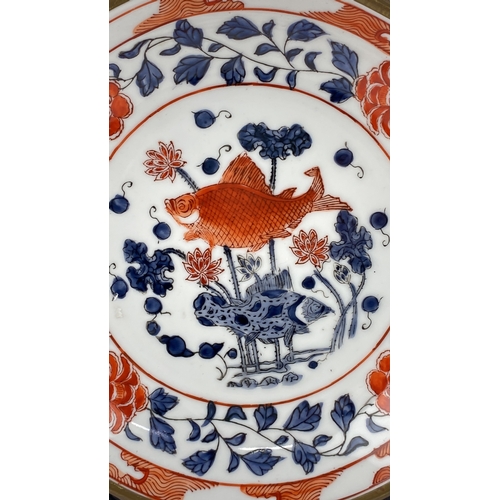 16 - Chinese Imari porcelain fish and flower bowl featuring vibrant red, blue, and white hand painted col... 