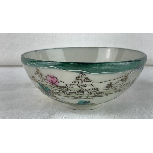 22 - Hand-painted Japanese porcelain bowl, featuring a serene landscape with figures and floral motifs. S... 