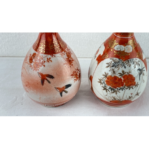 23 - Pair of Japanese Kutani porcelain vases, hand-painted with floral and bird motifs in red and gold ac... 