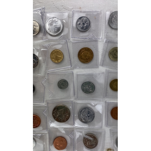 33 - Assorted world coins collection, featuring pieces from countries such as Lithuania, Turkey, Japan, P... 