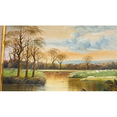 47 - Oil painting on canvas depicts a serene riverside landscape with trees and a cloudy sky, set in an o... 