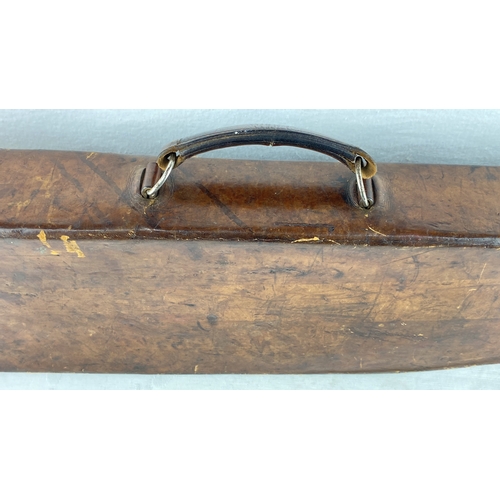 48 - Antique leather gun case with metal latches and a wooden handle.