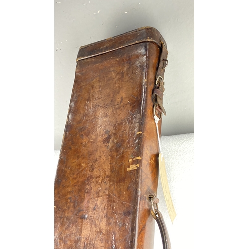 48 - Antique leather gun case with metal latches and a wooden handle.