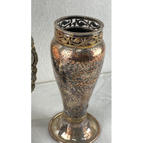 5 - Antique decorative lot featuring a silver plated vase with intricate pierced scrollwork and a copper... 