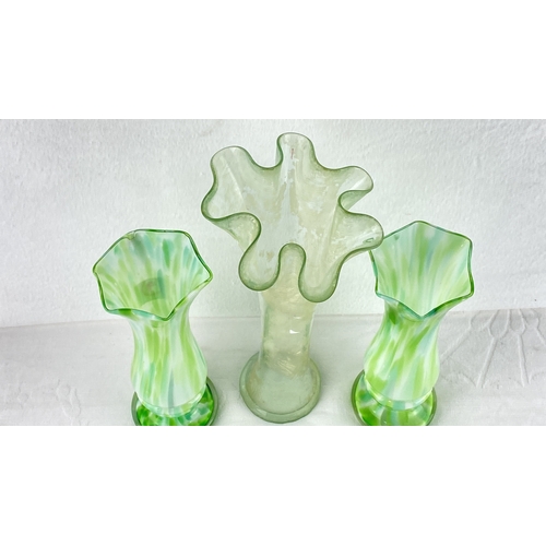 9 - Set of three green hand-blown glass vases with unique ruffled and fluted rims feature marbled patter... 