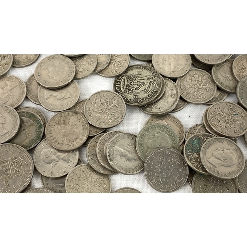 27 - A collection of British pre-decimal silver and cupronickel coins includes various denominations and ... 