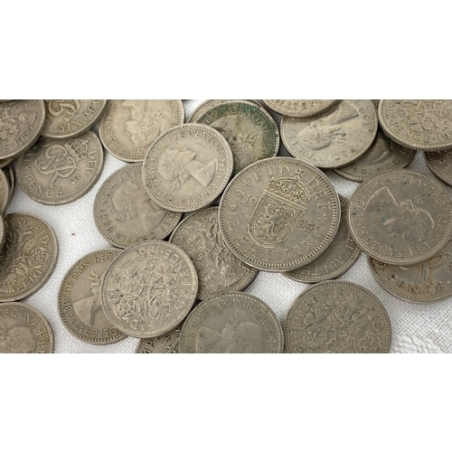 27 - A collection of British pre-decimal silver and cupronickel coins includes various denominations and ... 