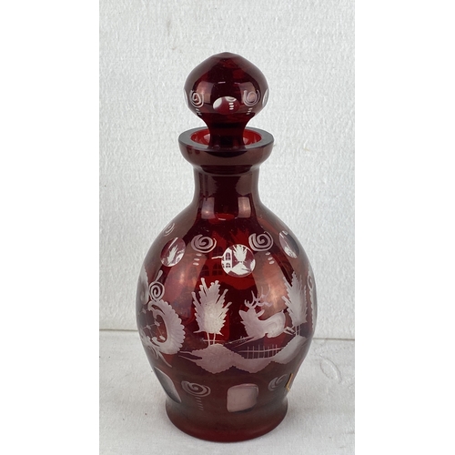 64 - Bohemian Ruby Red Cut-to-Clear Glass Decanter with Stopper. Features intricate etched designs of wil... 