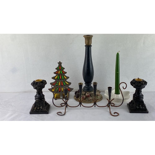 70 - Assorted vintage candle holders and candle-related decor, including metal, ceramic, and wooden piece... 