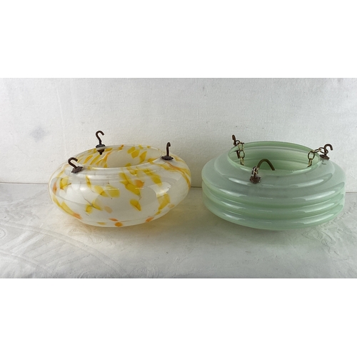 76 - Pair of vintage glass 'Fly Catcher' hanging light shades. One features a yellow and orange swirl des... 