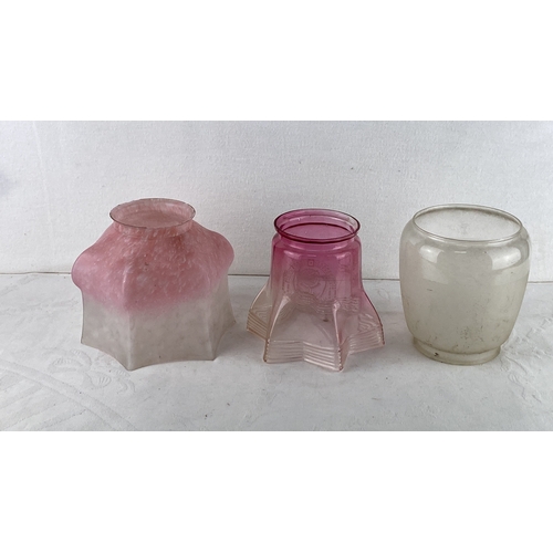 80 - Set of three vintage glass lamp shades, including a pink frosted shade, a pink etched star-shaped sh... 