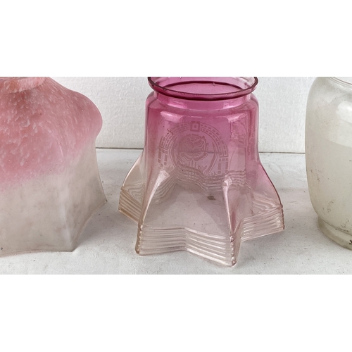 80 - Set of three vintage glass lamp shades, including a pink frosted shade, a pink etched star-shaped sh... 