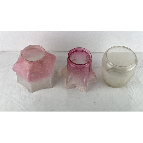 80 - Set of three vintage glass lamp shades, including a pink frosted shade, a pink etched star-shaped sh... 