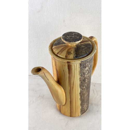 91 - Mid-Century Price Kensington ceramic coffee pot with ribbed texture and earthy glaze. It has a curve... 