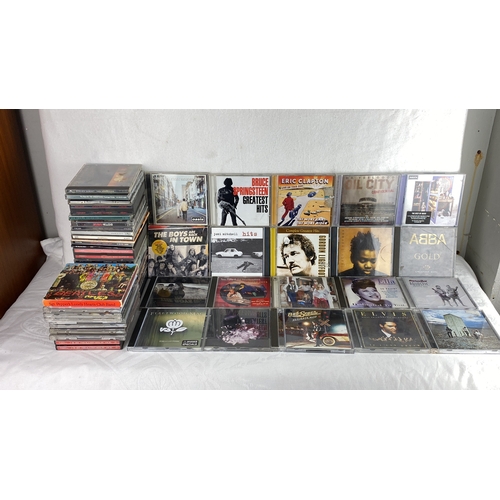 92 - Lot of music CDs featuring classic rock and popular artists including Oasis, Bruce Springsteen, Thin... 