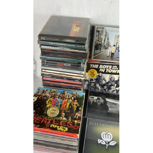 92 - Lot of music CDs featuring classic rock and popular artists including Oasis, Bruce Springsteen, Thin... 