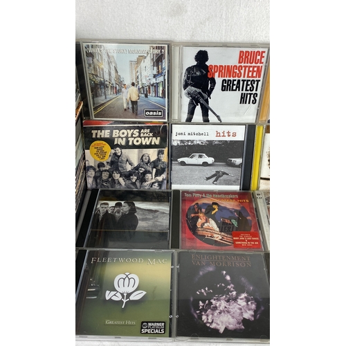 92 - Lot of music CDs featuring classic rock and popular artists including Oasis, Bruce Springsteen, Thin... 