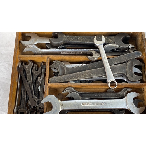 95 - Set of assorted open-end and ring spanners, neatly organized in a wooden compartment box. Brands inc... 