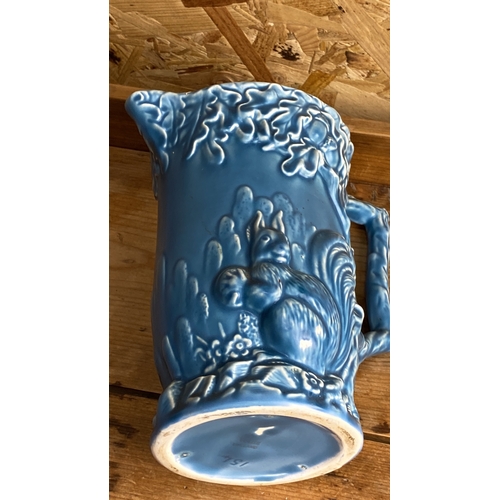 241 - Wade Ceramic Jug with a squirrel motif, marked 