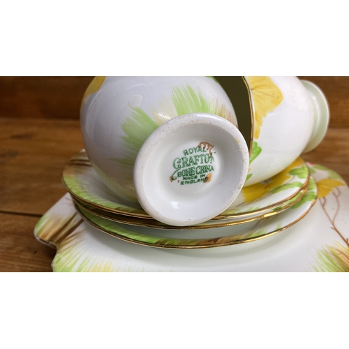 275 - Royal Grafton, bone china tea set, features a floral pattern with yellow, green, and orange accents,... 