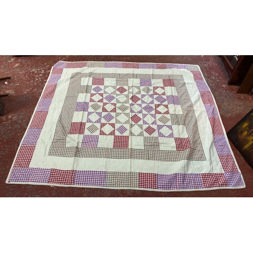 285 - Quilt features a checkerboard pattern with multi-colored plaid squares and white fabric inserts, tri... 