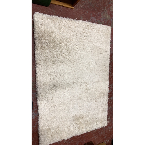 291 - Plush white shaggy rug with a high-pile texture.