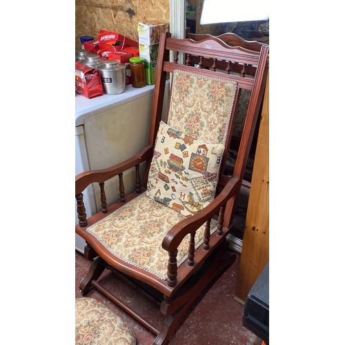 298 - Wooden rocking chair with floral upholstery and matching footstool, featuring turned spindle arms an... 